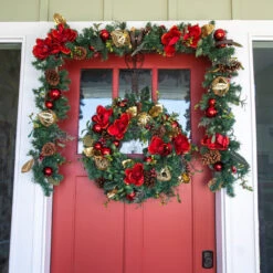 9' Pre-lit Battery Operated Green With Red Magnolias LED Artificial Christmas Garland - White Lights -Optimal Christmas Shop dvlc v 11093 007 57361.1667667503